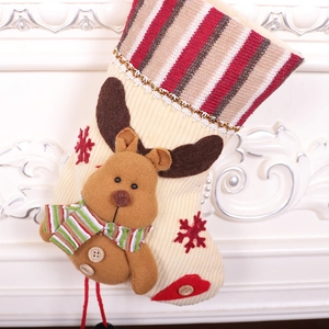 Beige knit Christmas stocking featuring a 3D plush reindeer and embroidered snowflakes