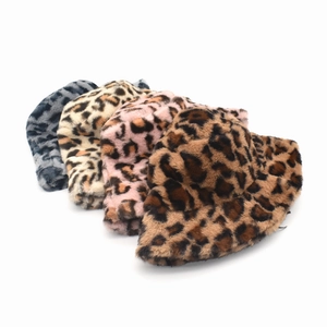 Detail of four leopard print faux fur bucket hats in grey, beige, pink, and brown