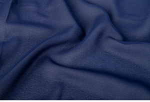 Detail shot of the navy blue chiffon fabric showing its soft texture and elegant drape