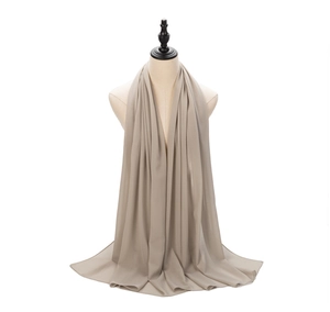 Detail of light beige chiffon hijab showing elegant drape and lightweight fabric texture