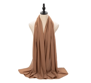 Detail of brown pearl chiffon hijab scarf showing soft texture and natural drape on mannequin