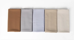 Flat lay of soft pearl chiffon hijabs in brown, grey, purple, and beige tones