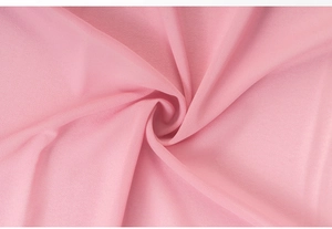 Close-up detail of soft pink pearl chiffon fabric with natural drapes and elegant textures
