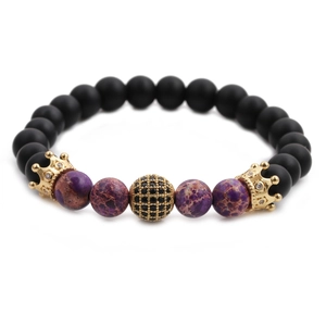 Men's beaded bracelet with matte black beads, purple natural stones, and golden crown charms