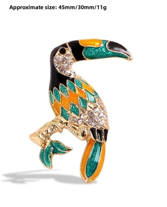 Detailed view showing tropical toucan brooch dimensions approx 45mm x 30mm and 11g weight