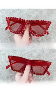 Detailed back view of oversized fashion sunglasses with luxury red rhinestone frame