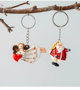 Creative Christmas angel and Santa resin charms hanging on a branch for holiday gifts