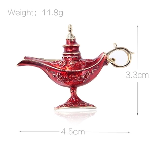 Aladdin magic lamp enamel brooch in red and gold with intricate floral engraving details