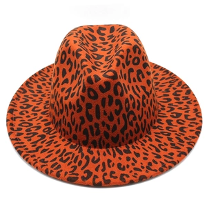 Top view of flat brim leopard print wool jazz fedora hat in orange and black tones