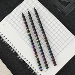 Three premium HB black wood pencils with colorful holographic patterns on a notebook