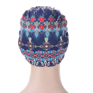 Rear view of elastic head wrap featuring ethnic geometric patterns on navy fabric