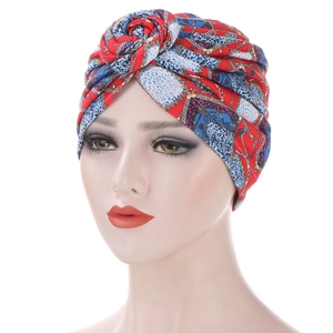 Detail of twist-knot headwrap with red, blue, and leopard print chain patterns