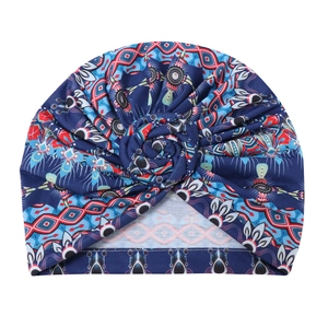 Ethnic geometric print turban hat with center twist knot and elastic knitted fabric