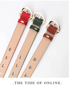Close-up of heart-shaped hollow eyelets on red, green, and brown PU leather belts