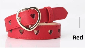 Detail of red hollow heart belt for women with a gold heart buckle close-up view