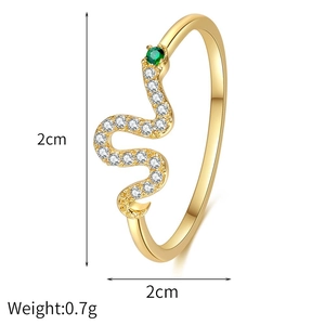 Macro detail of gold plated snake ring with green zircon eyes and weight dimensions