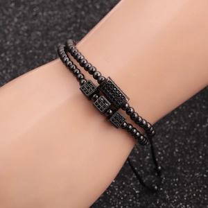 Men's set of two black 4mm copper bead bracelets with micro-pave cubic zirconia accents