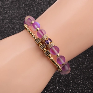 Double-layered beaded bracelet set with purple frosted beads and gold paved cube charm