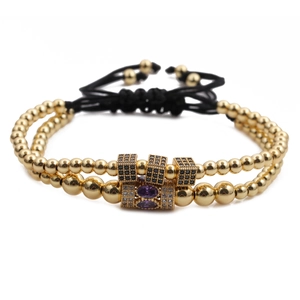 Double-layer gold beaded bracelet set with purple cubic zirconia and black cord