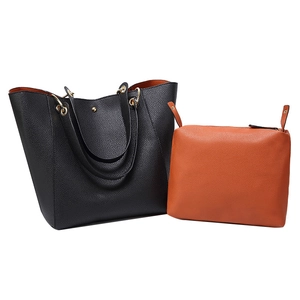 Large black PU leather tote bag set with orange inner pouch and gold hardware