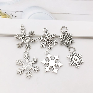 Set of 6 vintage silver alloy snowflake charms for DIY Christmas jewelry crafts