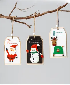 Detail of wooden Christmas gift tags featuring Santa, Snowman, and Reindeer with twine