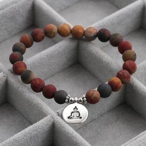 Detail of 8mm gray agate and turquoise beads with silver Buddha pendant in a jewelry box
