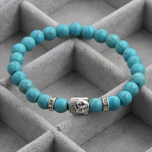 Ethnic 8mm blue turquoise bead bracelet with silver Buddha head and sparkling spacers