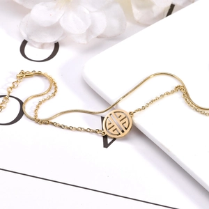 Double-layer gold plated stainless steel bracelet with a round hollow cutout pendant