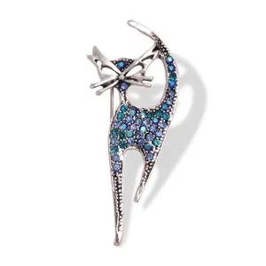 Vintage cat silhouette brooch in silver metal featuring gradient blue-green rhinestones