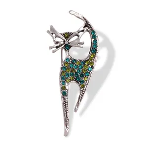 Vintage cat brooch with green and teal rhinestones on a silver alloy base for women