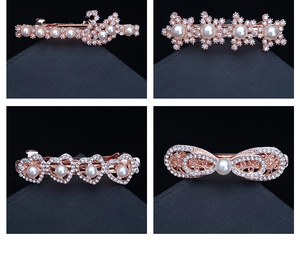 Detail view of rose gold hair clips with delicate pearls and sparkling crystals