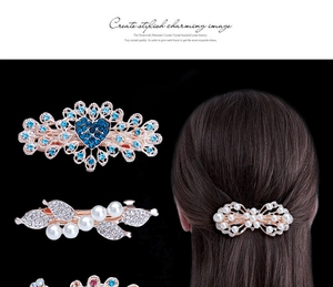 Detail of blue heart crystal and pearl hair clip set with rear view on model