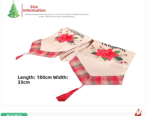 Detail of Christmas table runner with red poinsettia flowers and crimson tassel accents