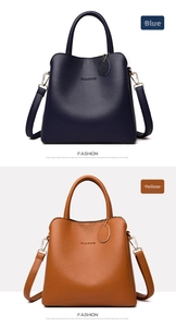 Close-up detail of textured leather handbags in navy and caramel with CLASSIC logo