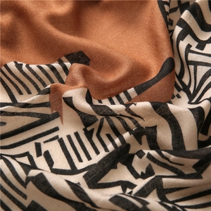 Macro view of geometric pattern and soft woven texture on this cotton linen shawl
