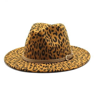 Detail of leopard print wool jazz fedora hat with brown leather belt and gold metal buckle