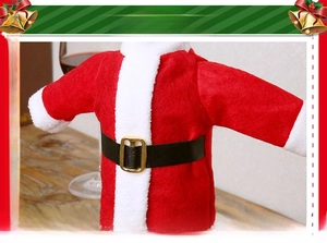 Close-up of Santa Claus wine bottle cover with soft red velvet and plush white trim
