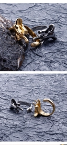 Detailed relief of vintage elephant trunk ring in gold and gun black finish