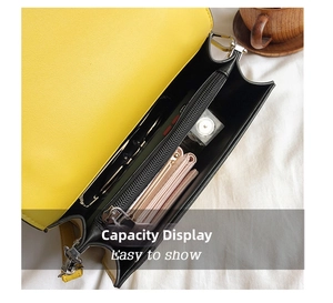 Interior view of yellow crossbody bag with zipper compartment showing daily storage space