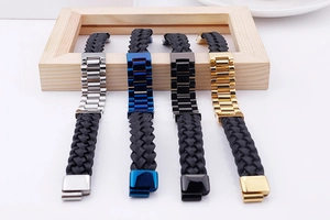Macro view of woven leather bracelets with silver, blue, black, and gold metal clasps