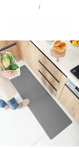 Detail view of dark gray PU leather kitchen mat with waterproof anti-slip texture