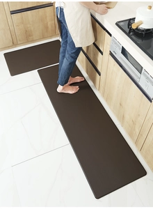 Detailed view of dual brown kitchen floor mats with waterproof anti-slip PU texture