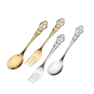 Vintage European embossed stainless steel dessert spoon and fruit fork set in gold and silver