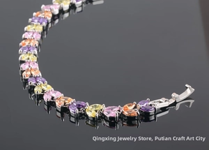 Detailed macro view of silver bracelet with colorful marquise-cut AAA cubic zirconia