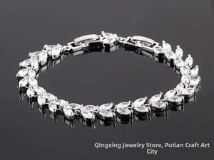 Detail of marquise-cut zircon stones in a wheat-ear design on a silver bracelet