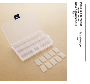 Detailed macro shot of a clear 15-compartment storage box with removable dividers