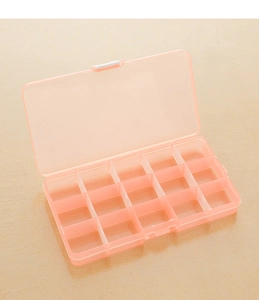 Overhead view of a pink translucent 15-compartment plastic organizer box with locking lid