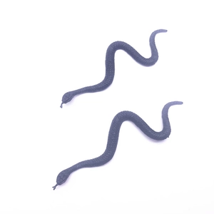 Detailed view of two realistic black rubber snake models with fine scale textures