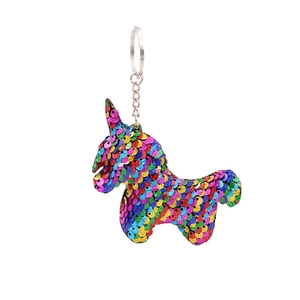 Colorful sequin unicorn keychain with metal ring on white background for car or bag accessory